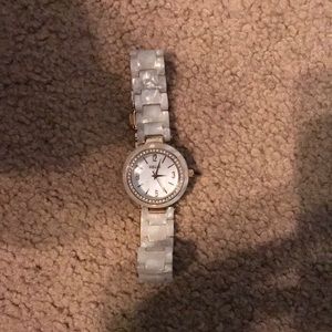 White pearl colored watch. Mostly for show. Will work if you put batteries in.